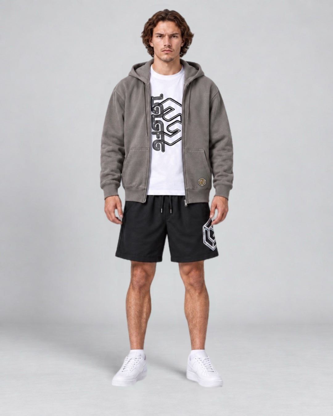 LGLGFG Trio Kit with zip hoodie, graphic T shirt and black shorts, model side view