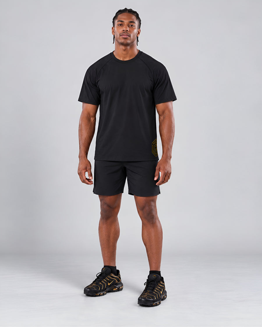 LGLGFG Hybrid T in Black worn by model, full length second angle