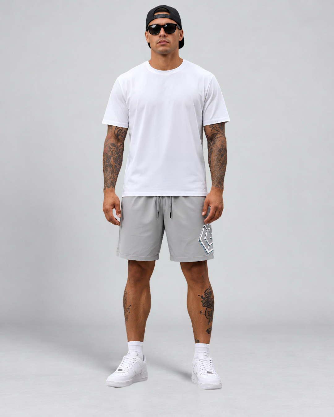 LGLGFG Nexus Board Shorts in Light Grey worn by model, full length second angle