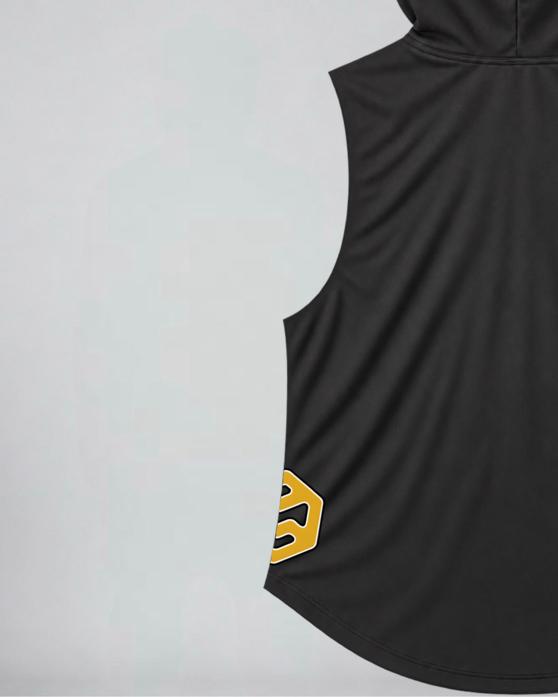 Close-up of a black sleeveless hoodie with a gold side logo