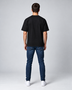 LGLGFG Baller T in Black worn by model, full length. Men's box cut tee