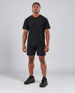 LGLGFG Hybrid T in Black worn by model, full length second angle