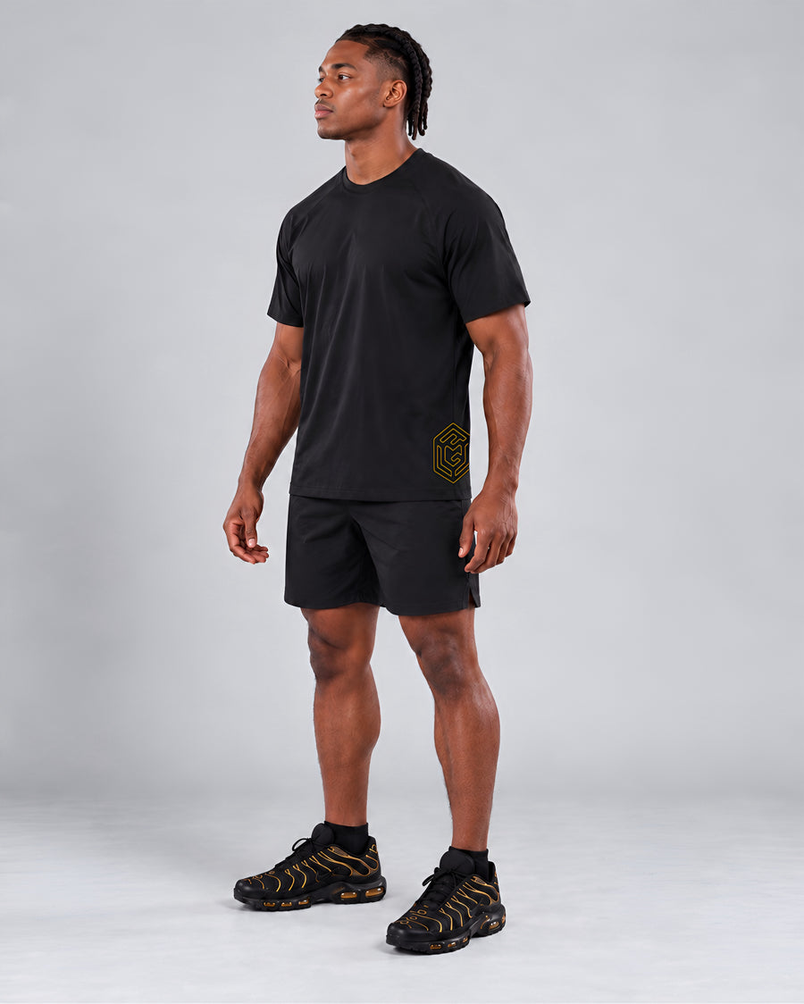 LGLGFG Hybrid T in Black worn by model, full length third angle